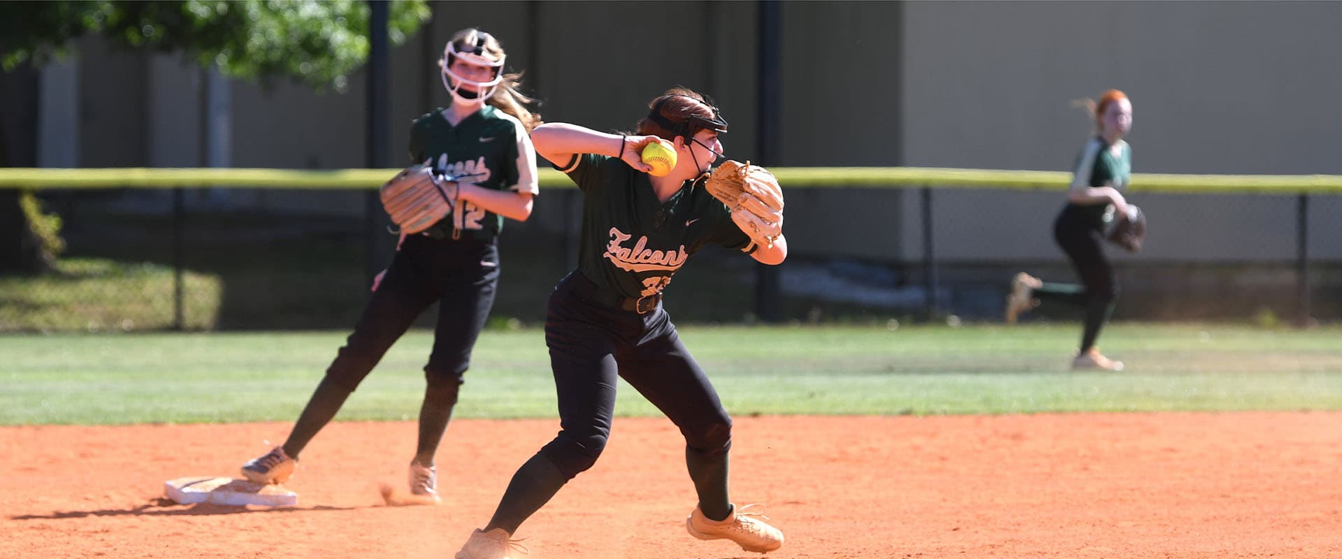 Students playing softball